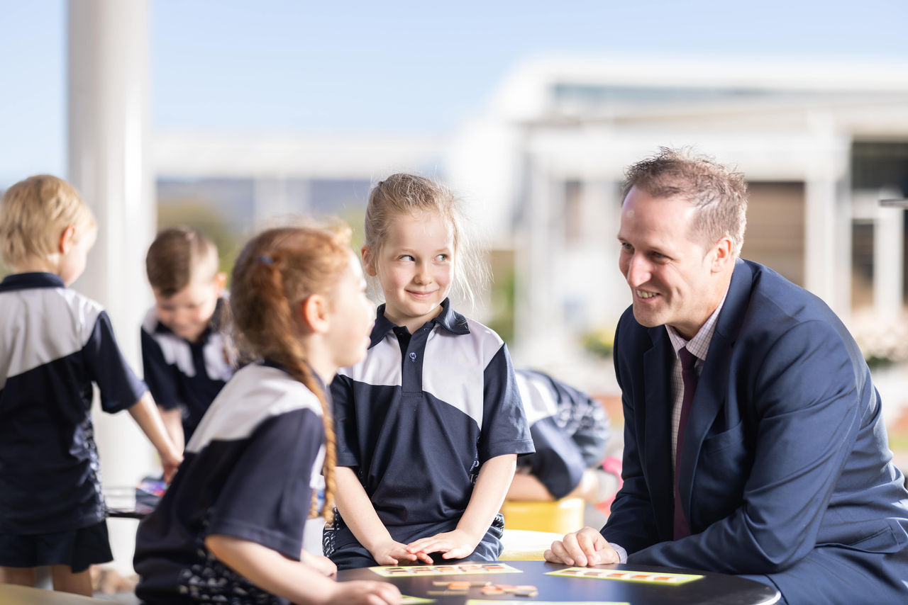 teacher and students talking